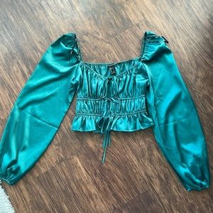 Emerald green long sleeve going out top.